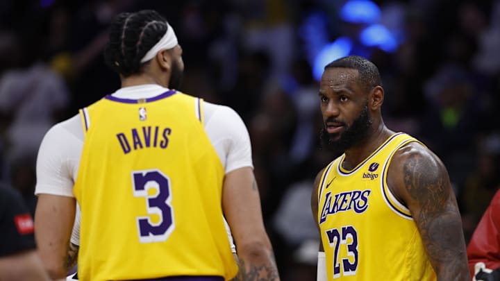 Apr 3, 2024; Washington, District of Columbia, USA; Los Angeles Lakers forward LeBron James (23) talks with Lakers forward Anthony Davis (3) against the Washington Wizards at Capital One Arena. Mandatory Credit: Geoff Burke-Imagn Images