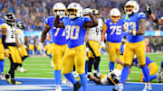 Nov 9, 2025; Inglewood, California, USA; Los Angeles Chargers running back Kimani Vidal (30) celebrates after scoring a touchdown against the Pittsburgh Steelers during the fourth quarter of the game at SoFi Stadium. Mandatory Credit: Gary A. Vasquez-Imagn Images