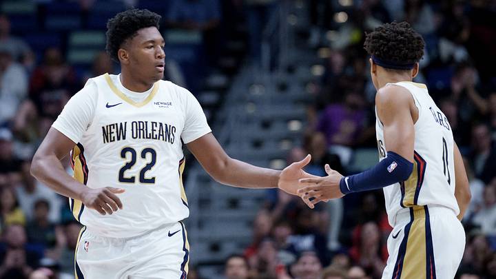 Dec 26, 2025; New Orleans, Louisiana, USA;  New Orleans Pelicans center Derik Queen (22) celebrates a basket with guard Jeremiah Fears (0) during the first half against the Phoenix Suns at Smoothie King Center. Mandatory Credit: Matthew Hinton-Imagn Images