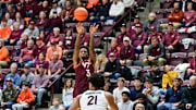 Feb 15, 2025; Blacksburg, Virginia, USA; Virginia Tech Hokies guard Jaydon Young (3) shoots the ball over Virginia Cavaliers forward Anthony Robinson (21) during the first half at Cassell Coliseum. Mandatory Credit: Brian Bishop-Imagn Images