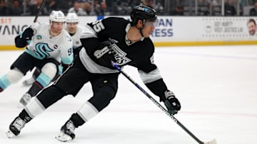 Apr 7, 2025; Los Angeles, California, USA;  Los Angeles Kings right wing Quinton Byfield (55) skates with the puck during the third period against the Seattle Kraken at Crypto.com Arena. Mandatory Credit: Kiyoshi Mio-Imagn Images