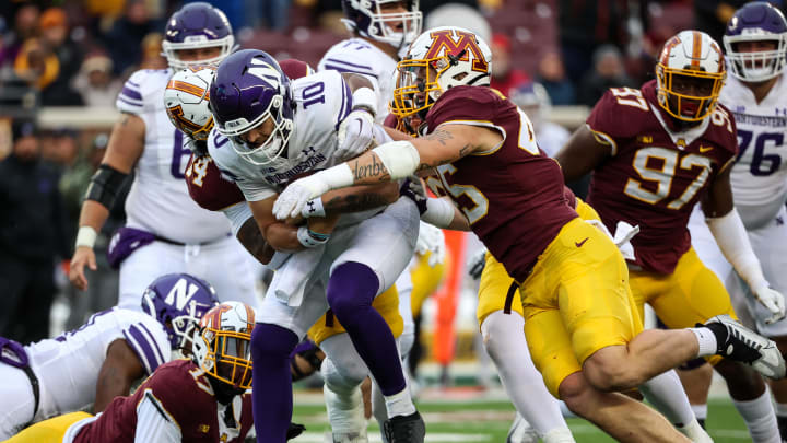 Nov 12, 2022; Minneapolis, Minnesota, USA;Minnesota Golden Gophers linebacker Cody Lindenberg (45) tackles Northwestern Wildcats quarterback Brendan Sullivan (10) during the first quarter at Huntington Bank Stadium. Mandatory Credit: Matt Krohn-USA TODAY Sports