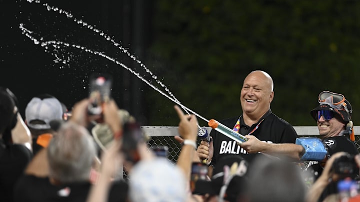 Sep 6, 2024; Baltimore, Maryland, USA; National Baseball Hall of Fame member Cal Ripken  reacts while spraying spectators with water in the Bird Bath during the third inning of the game between the Baltimore Orioles and the Tampa Bay Rays  at Oriole Park at Camden Yards. 