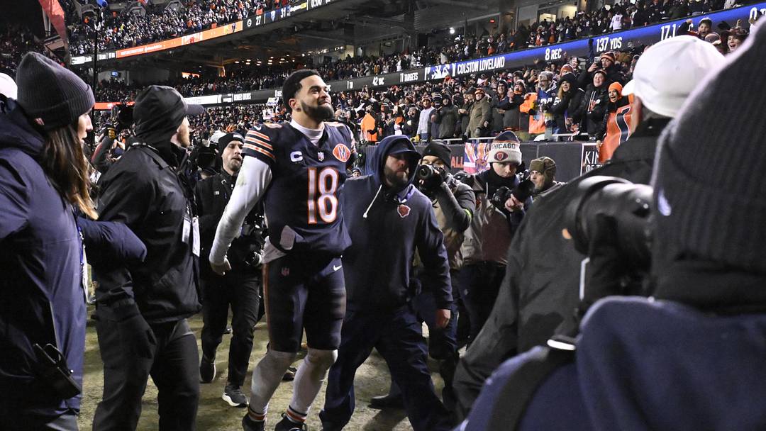 Caleb Williams celebrates the playoff win over Green Bay. Vegas lines currently favor the Bears in 12 games for 2026.