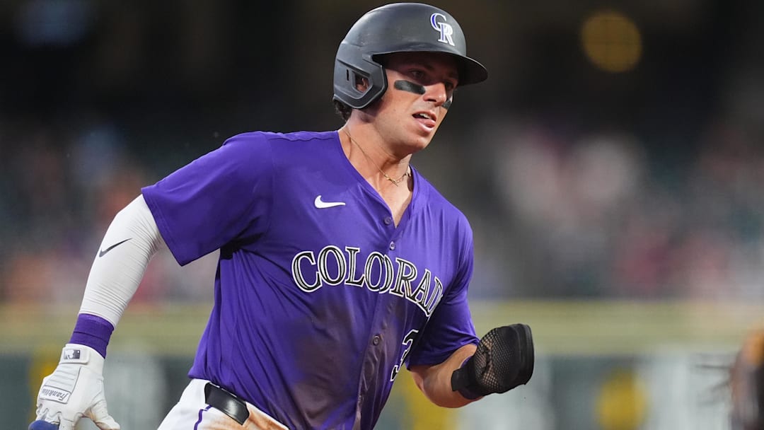 Aug 28, 2024; Denver, Colorado, USA; Colorado Rockies catcher Drew Romo (3) heads home to score a run in the third inning against the Miami Marlins at Coors Field. Mandatory Credit: Ron Chenoy-Imagn Images