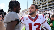 Sep 30, 2023; Boulder, Colorado, USA;  Colorado Buffaloes quarterback Shedeur Sanders (2) meets with USC Trojans quarterback Caleb Williams (13) after the game at Folsom Field. Mandatory Credit: John Leyba-Imagn Images