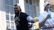 Nov 1, 2024; Los Angeles, CA, USA;  Los Angeles Dodgers outfielder Teoscar Hernandez (left) celebrates with fans during the Dodgers 2024 World Series Championship parade in downtown Los Angeles.  