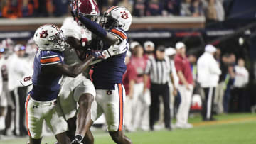 Nov 25, 2023; Auburn, Alabama, USA;  Auburn Tigers cornerback Nehemiah Pritchett (1) and safety Zion Puckett (10) battle for a pass intended for Alabama Crimson Tide tight end Amari Niblack (84) at Jordan-Hare Stadium. Alabama won 27-24. Mandatory Credit: Gary Cosby Jr.-USA TODAY Sports