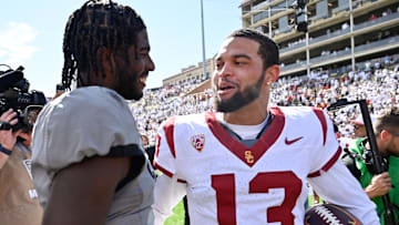 Sep 30, 2023; Boulder, Colorado, USA;  Colorado Buffaloes quarterback Shedeur Sanders (2) meets with USC Trojans quarterback Caleb Williams (13) after the game at Folsom Field. Mandatory Credit: John Leyba-Imagn Images