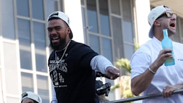Nov 1, 2024; Los Angeles, CA, USA;  Los Angeles Dodgers outfielder Teoscar Hernandez (left) celebrates with fans during the Dodgers 2024 World Series Championship parade in downtown Los Angeles.  