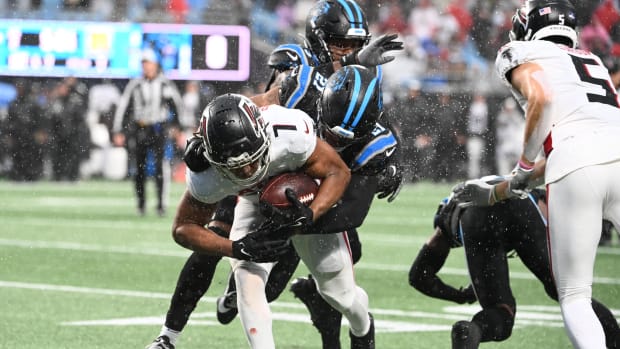 Atlanta Falcons running back Bijan Robinson (7) is tackled by Carolina Panther Jeremy Chin