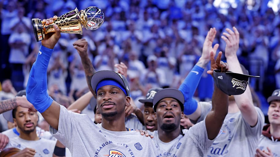 Gilgeous-Alexander holds the West Conference Finals MVP trophy as he celebrates with teammates after defeating the Timberwolves to advance to the NBA Finals. | Alonzo Adams-Imagn Images