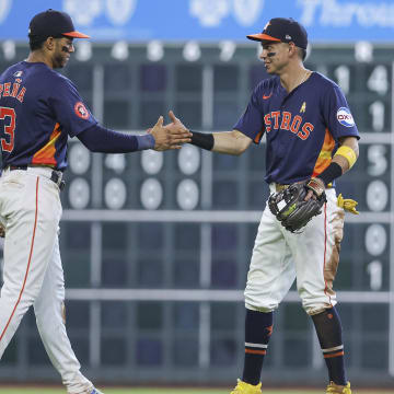 Sep 1, 2024; Houston, Texas, USA; Houston Astros shortstop Jeremy Pena (3) and second baseman Mauricio Dubon (14) celebrate after the game against the Kansas City Royals at Minute Maid Park. Mandatory Credit: Troy Taormina-USA TODAY Sports