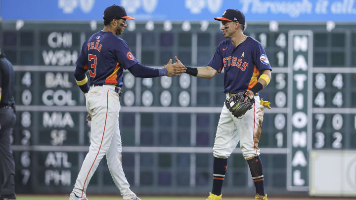 Sep 1, 2024; Houston, Texas, USA; Houston Astros shortstop Jeremy Pena (3) and second baseman Mauricio Dubon (14) celebrate after the game against the Kansas City Royals at Minute Maid Park. Mandatory Credit: Troy Taormina-USA TODAY Sports