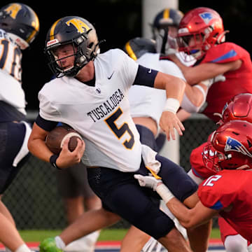 Tuscaloosa Academy's Mark Norris (5) is tackled by ACA's Parker Graves (12) and ACA’s Will Durrett (2) at American Christian Academy Aug. 21 to open the 2025 high school football season in Alabama.