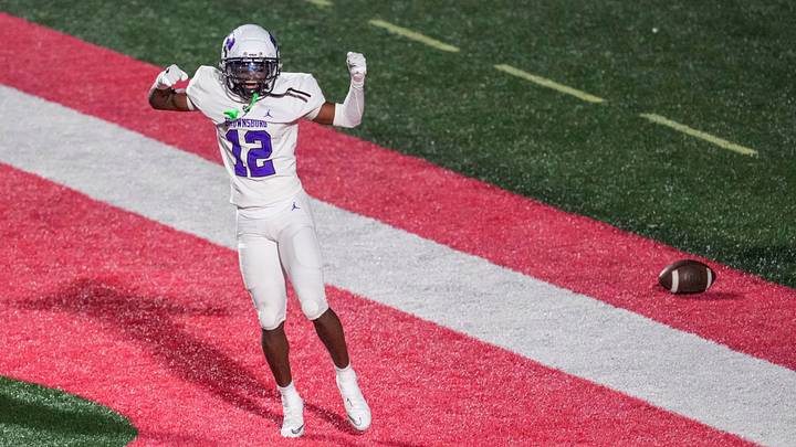 Brownsburg Bulldogs Branden Sharpe (12) celebrates a touchdown Friday, Aug. 21, 2026, during a game at Lawrence North High School in Indianapolis.