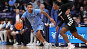 Dec 3, 2024; Villanova, Pennsylvania, USA; Villanova Wildcats guard Jhamir Brickus (2) drives against Cincinnati Bearcats guard Day Day Thomas (1) in the first half at William B. Finneran Pavilion. Mandatory Credit: Kyle Ross-Imagn Images