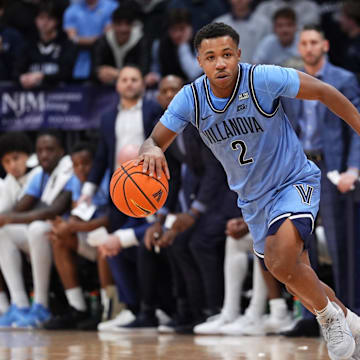 Dec 3, 2024; Villanova, Pennsylvania, USA; Villanova Wildcats guard Jhamir Brickus (2) drives against Cincinnati Bearcats guard Day Day Thomas (1) in the first half at William B. Finneran Pavilion. Mandatory Credit: Kyle Ross-Imagn Images