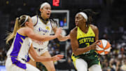 Sep 1, 2025; Seattle, Washington, USA; Seattle Storm forward Nneka Ogwumike (3) looks to pass away from a double team by Los Angeles Sparks forward Dearica Hamby (5) and guard Julie Allemand (20) during the second quarter at Climate Pledge Arena. Mandatory Credit: Joe Nicholson-Imagn Images