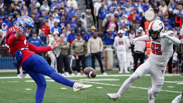 Nov 11, 2023; Lawrence, Kansas, USA; Kansas Jayhawks punter Damon Greaves (95) punts against Texas Tech Red Raiders