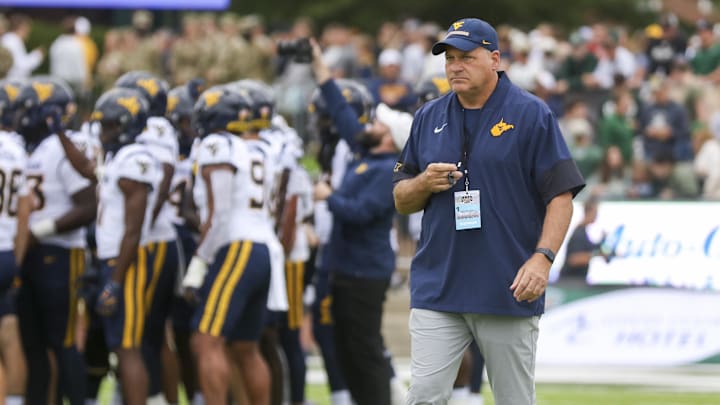 Sep 6, 2025; Athens, Ohio, USA; West Virginia Mountaineers head coach Rich Rodriguez during warmups prior to their game against the Ohio Bobcats at Peden Stadium. Mandatory Credit: Ben Queen-Imagn Images