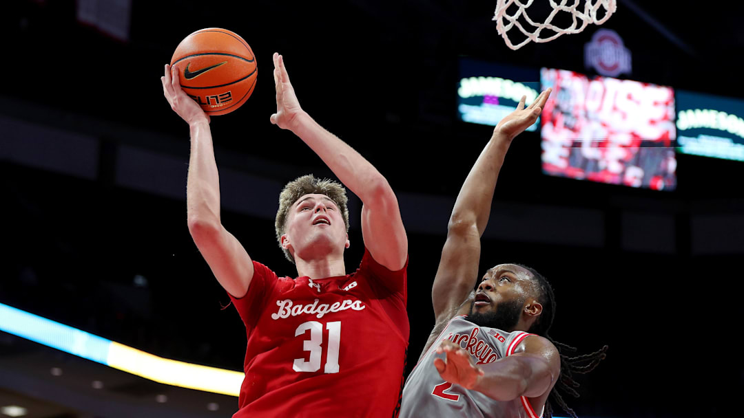 Feb 17, 2026; Columbus, Ohio, USA; Wisconsin Badgers forward Nolan Winter (31) drives to the basket as Ohio State Buckeyes guard Bruce Thornton (2) defends during the first half at Value City Arena. Mandatory Credit: Joseph Maiorana-Imagn Images Feb 17, 2026; Columbus, Ohio, USA; Wisconsin Badgers forward Nolan Winter (31) drives to the basket as Ohio State Buckeyes guard Bruce Thornton (2) defends during the first half at Value City Arena. Mandatory Credit: Joseph Maiorana-Imagn Images