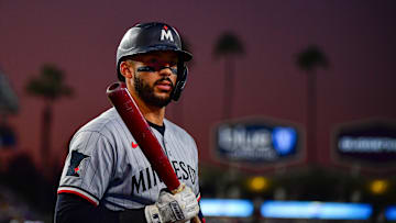 Jul 21, 2025; Los Angeles, California, USA; Minnesota Twins shortstop Carlos Correa (4) on deck during the fifth inning at Dodger Stadium. Mandatory Credit: Gary A. Vasquez-Imagn Images