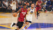 Oct 27, 2022; San Francisco, California, USA; Miami Heat forward Jimmy Butler (22) dribbles past Golden State Warriors guard Stephen Curry (30) in the first quarter at the Chase Center. Mandatory Credit: Cary Edmondson-Imagn Images