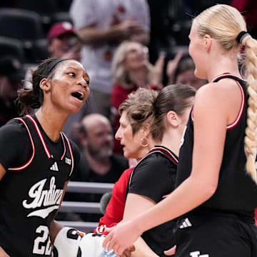 Indiana Hoosiers guard Chloe Moore-McNeil (22) celebrates with Indiana Hoosiers forward Faith Wiseman (31) on Thursday, March 6, 2025, during the Big Ten women's tournament at Gainbridge Fieldhouse in Indianapolis. Indiana Hoosiers defeated the Oregon Ducks, 78-62.