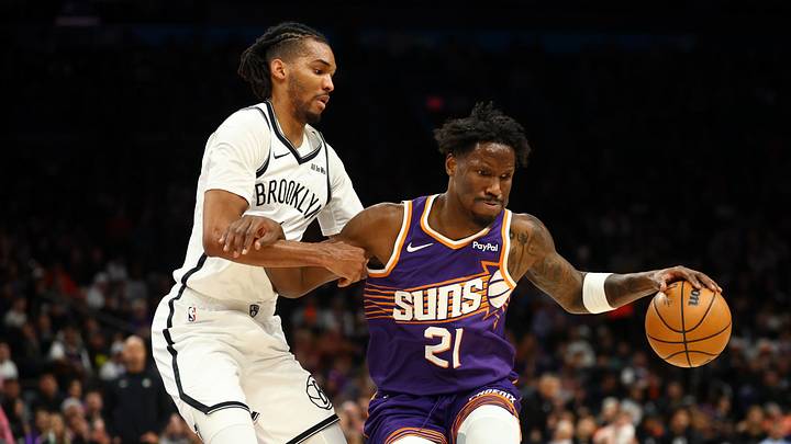 Jan 27, 2026; Phoenix, Arizona, USA; Phoenix Suns forward Nigel Hayes-Davis (21) drives to the basket against Brooklyn Nets forward Ziaire Williams (1) in the first half at Mortgage Matchup Center. Mandatory Credit: Mark J. Rebilas-Imagn Images