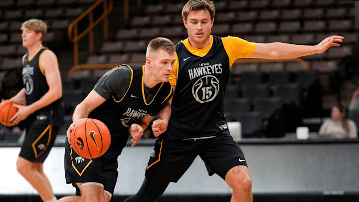 Iowa’s Brendan Hausen (15) guards Bennett Stirtz (14) during a drill at practice Oct. 15, 2025 at Carver-Hawkeye Arena in Iowa City, Iowa.