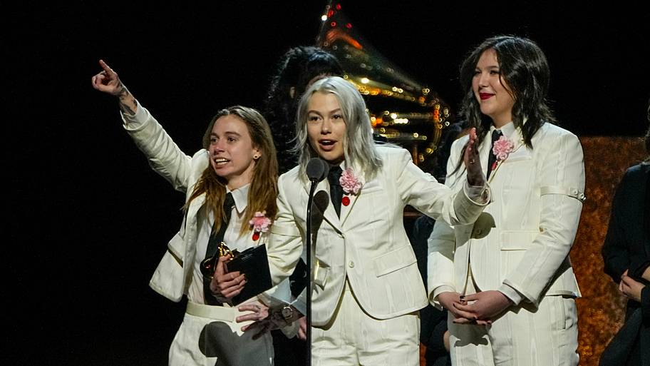 Julien Baker, from left, Phoebe Bridgers and Lucy Dacus of Boygenius accept an award during the 66th Annual GRAMMY Awards.