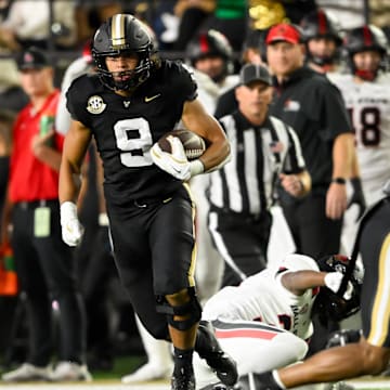 Oct 19, 2024; Nashville, Tennessee, USA;  Vanderbilt Commodores tight end Eli Stowers (9) runs the ball against the Ball State Cardinals during the first half at FirstBank Stadium. Mandatory Credit: Steve Roberts-Imagn Images