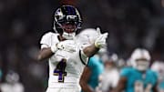 Baltimore Ravens wide receiver Zay Flowers (4) reacts after a runs for a gain during the third quarter against the Miami Dolphins at Hard Rock Stadium. 