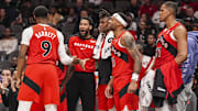 Jan 25, 2025; Atlanta, Georgia, USA; Toronto Raptors guard RJ Barrett (9) reacts with the Raptors bench after scoring a basket against the Atlanta Hawks during the second half at State Farm Arena. Mandatory Credit: Dale Zanine-Imagn Images