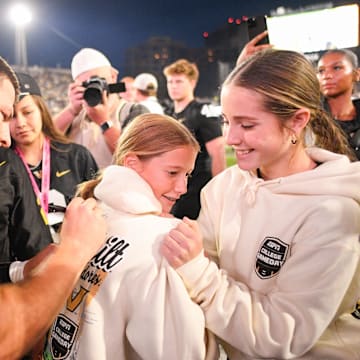 Oct 25, 2025; Nashville, Tennessee, USA;  Vanderbilt Commodores quarterback Diego Pavia (2) sign the back of a fans hoodie against the Missouri Tigers during the second half at FirstBank Stadium. Mandatory Credit: Steve Roberts-Imagn Images