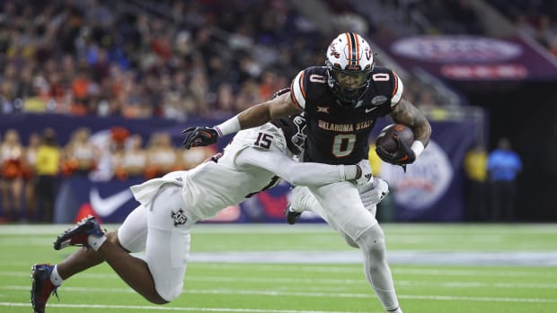 Oklahoma State Cowboys running back Ollie Gordon II (0) runs with the ball. Troy Taormina-USA TODAY Sports