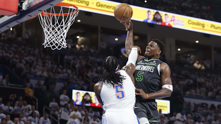 May 20, 2025; Oklahoma City, Oklahoma, USA; Minnesota Timberwolves guard Anthony Edwards (5) drives against Oklahoma City Thunder guard Luguentz Dort (5) in the second quarter during game one of the western conference finals for the 2025 NBA Playoffs at Paycom Center. Mandatory Credit: Alonzo Adams-Imagn Images