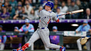 Aug 29, 2025; Denver, Colorado, USA; Chicago Cubs center fielder Pete Crow-Armstrong (4) hits a sacrifice fly RBI in the fifth inning against the Colorado Rockies at Coors Field. 