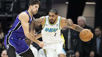 December 22, 2024; Sacramento, California, USA; Indiana Pacers forward Obi Toppin (1) dribbles the basketball against Sacramento Kings forward Doug McDermott (7) during the first quarter at Golden 1 Center. Mandatory Credit: Kyle Terada-Imagn Images
