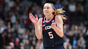 Mar 31, 2025; Spokane, WA, USA; UConn Huskies guard Paige Bueckers (5) reacts after a play against the USC Trojans during the first half of a Elite 8 NCAA Tournament basketball game at Spokane Arena. Mandatory Credit: James Snook-Imagn Images