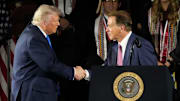May 1, 2025; Tuscaloosa, AL, USA; President Donald Trump shakes hands with legendary Alabama football coach Nick Saban before delivering a special commencement address to University of Alabama graduates at Coleman Coliseum. Graduation occurs over the weekend. Mandatory Credit: Gary Cosby Jr.-Tuscaloosa News
