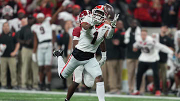 Jan 10, 2022; Indianapolis, IN, USA; Georgia Bulldogs wide receiver George Pickens (right) catches a 52 yard pass against Alabama Crimson Tide defensive back Kool-Aid McKinstry (left) during the first quarter of the 2022 CFP college football national championship game at Lucas Oil Stadium. Mandatory Credit: Kirby Lee-Imagn Images