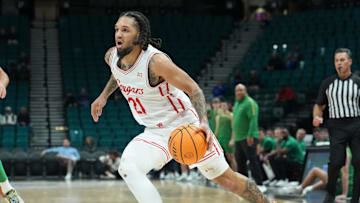 Nov 26, 2025; Las Vegas, NV, USA; Houston Cougars guard Emanuel Sharp (21) dribbles the ball against the Notre Dame Fighting Irish in the 2025 Players Era Festival at MGM Grand Garden Arena. Mandatory Credit: Kirby Lee-Imagn Images