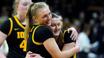 Iowa guard Sydney Affolter (3) hugs Iowa guard Taylor Stremlow (1) after the Hawkeyes defeated Wisconsin 81-66 Sunday, March 2, 2025 at Carver-Hawkeye Arena in Iowa City, Iowa.