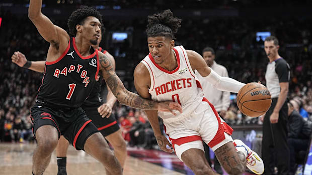 Houston's Rockets Guardian Jalen Green (0) goes to the basket in front of the Toronto Raptors Armoni Brooks (1) Guard (1) 