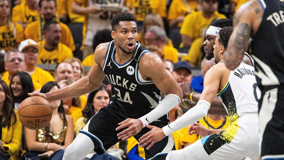 Apr 29, 2025; Indianapolis, Indiana, USA; Milwaukee Bucks forward Giannis Antetokounmpo (34) dribbles the ball while Indiana Pacers forward Jarace Walker (5)  defends during game five of the first round for the 2025 NBA Playoffs at Gainbridge Fieldhouse. Mandatory Credit: Trevor Ruszkowski-Imagn Images