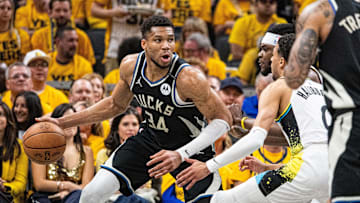 Apr 29, 2025; Indianapolis, Indiana, USA; Milwaukee Bucks forward Giannis Antetokounmpo (34) dribbles the ball while Indiana Pacers forward Jarace Walker (5)  defends during game five of the first round for the 2025 NBA Playoffs at Gainbridge Fieldhouse. Mandatory Credit: Trevor Ruszkowski-Imagn Images