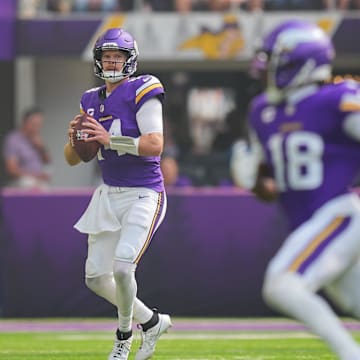 Sep 15, 2024; Minneapolis, Minnesota, USA; Minnesota Vikings quarterback Sam Darnold (14) looks to pass against the San Francisco 49ers in the first quarter at U.S. Bank Stadium.