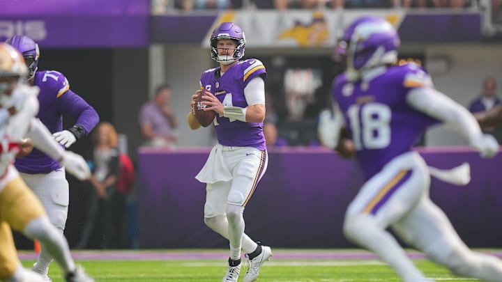 Sep 15, 2024; Minneapolis, Minnesota, USA; Minnesota Vikings quarterback Sam Darnold (14) looks to pass against the San Francisco 49ers in the first quarter at U.S. Bank Stadium.